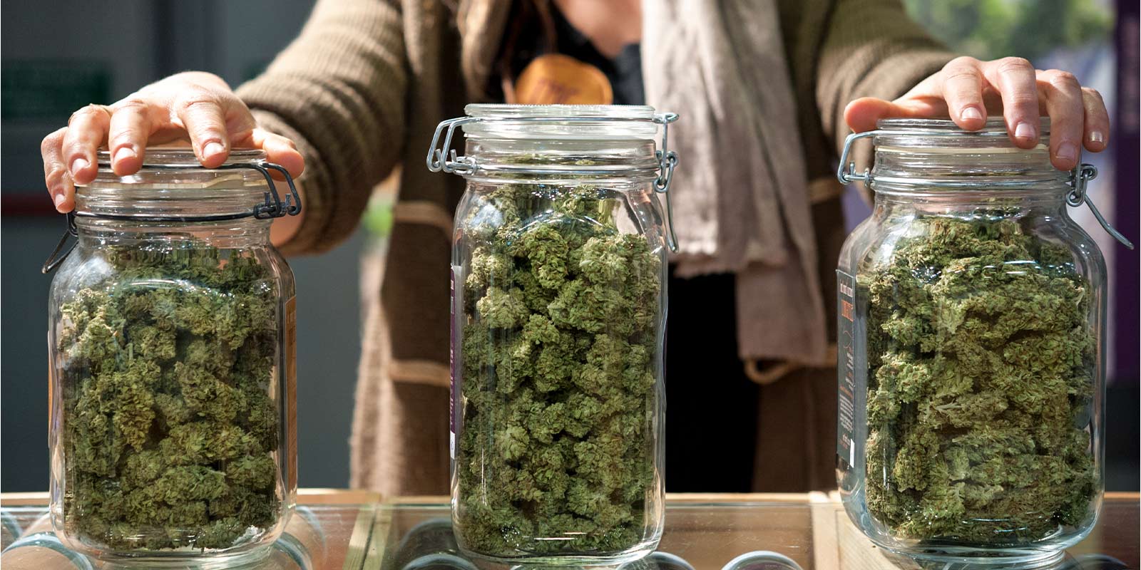 jars of different strains of weed that could make you sleepy