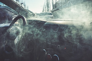 smoke fogging up the window in a car