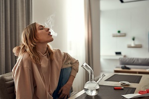 women legally smoking in her apartment