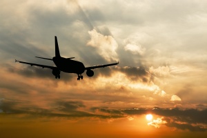 sunset of a airplane with weed on it