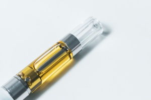 a electric  Cannabis Cartridges on a white table