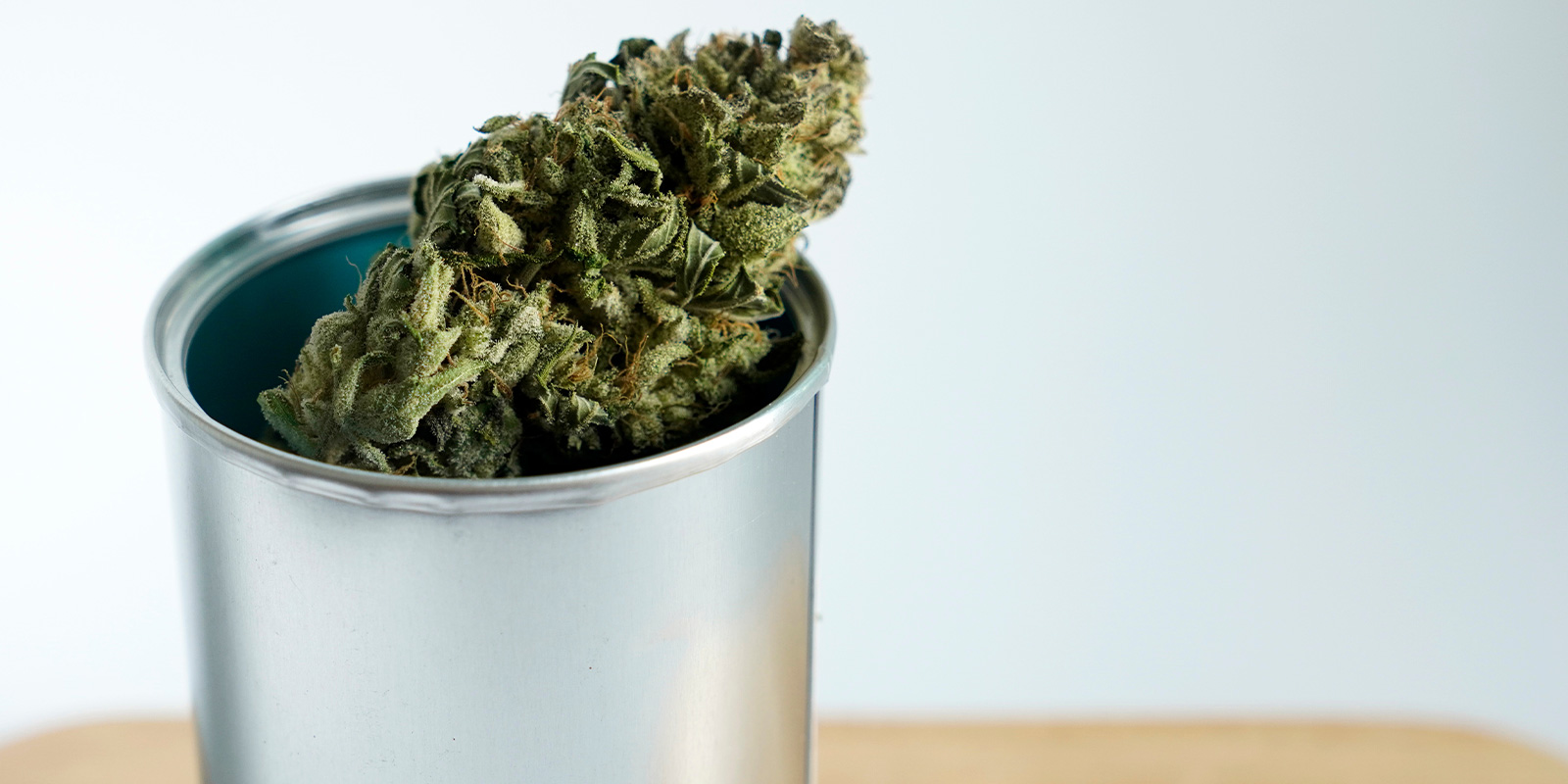cannabis flower in a metal box