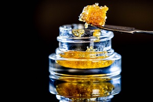 dab sauce cannabis oil macro with jar isolated