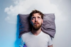 man having the sleeping problem of insomnia