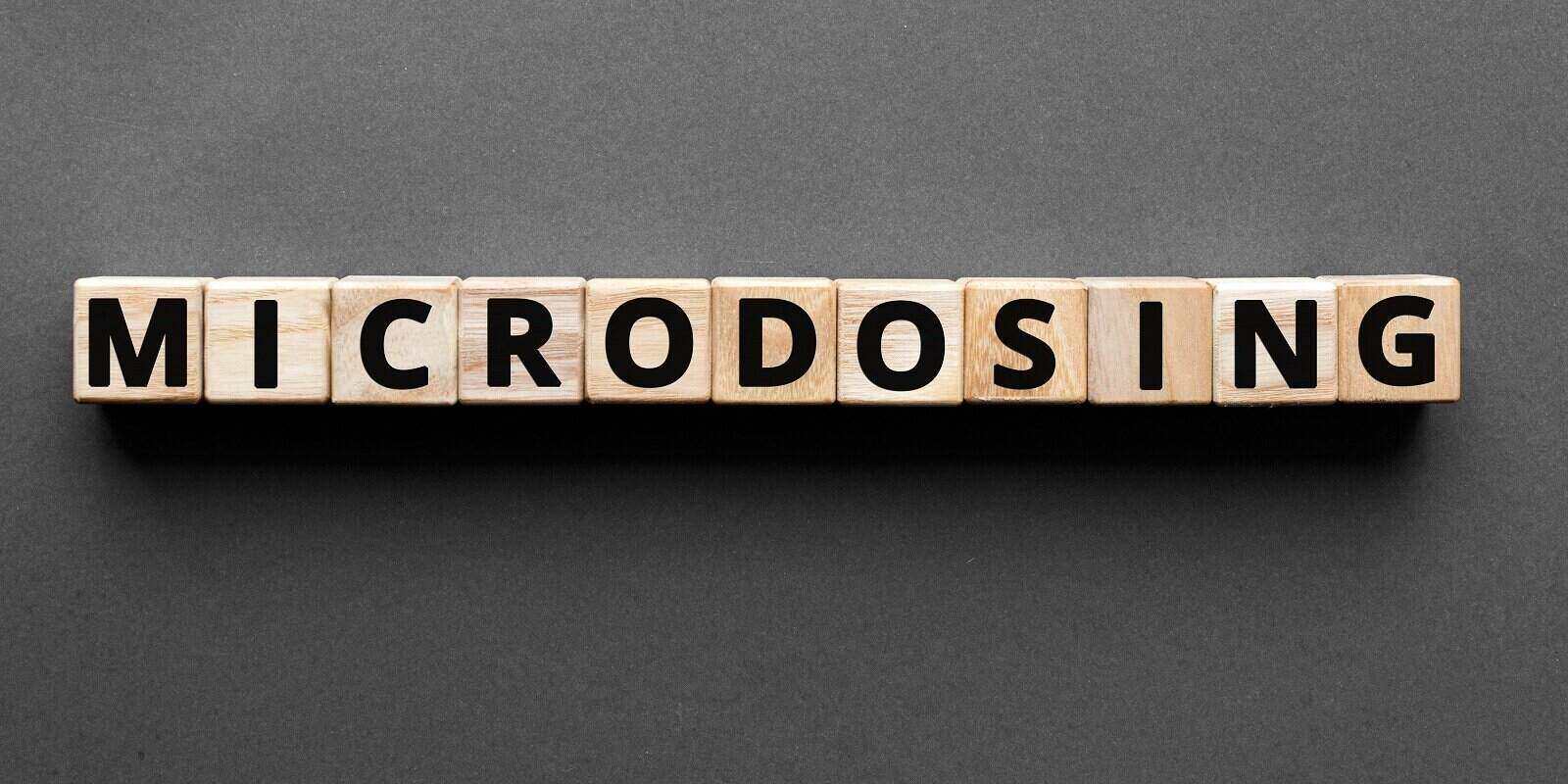 microdosing word from wooden blocks with letters
