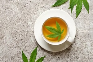 cannabis tea in white cup