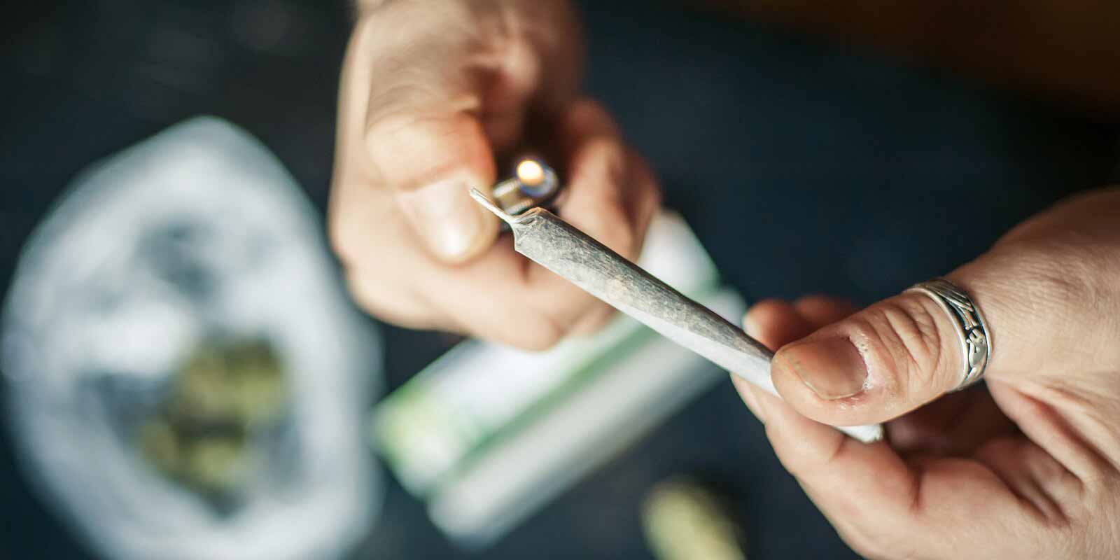 lighting up marijuana joint with lighter