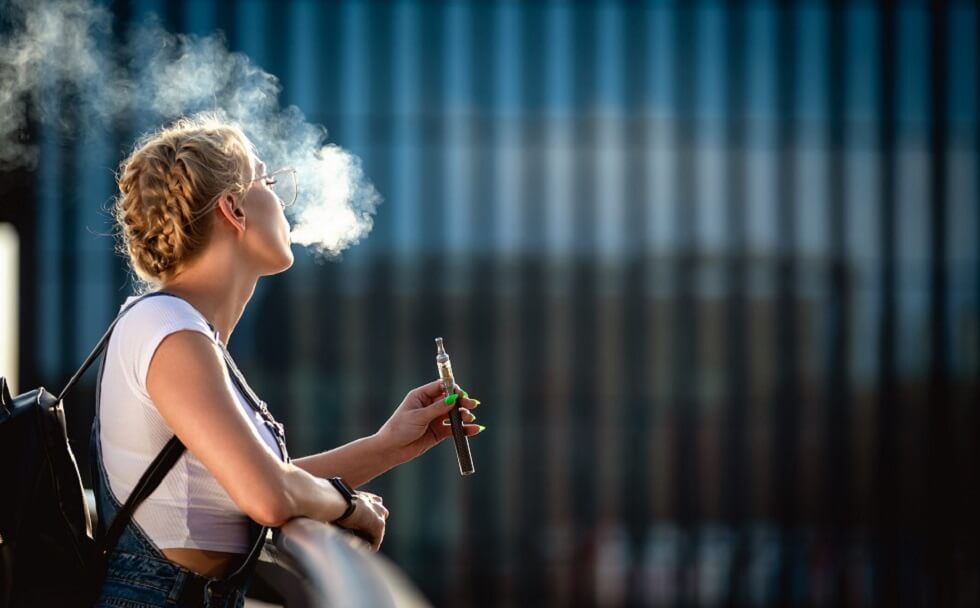 women smoking vape pen