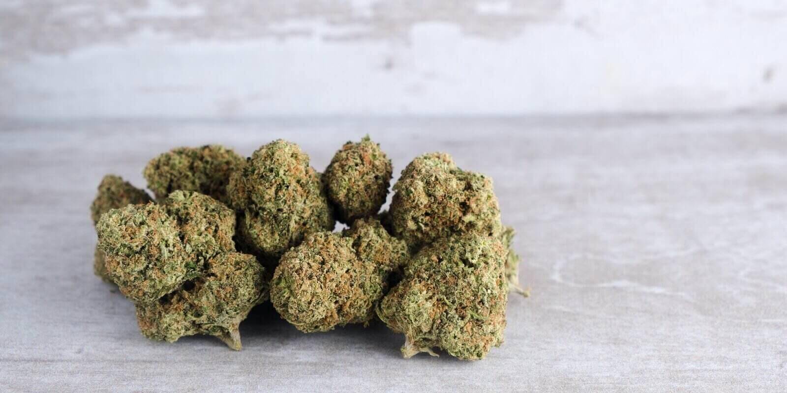 recreational marijuana on a white stone background
