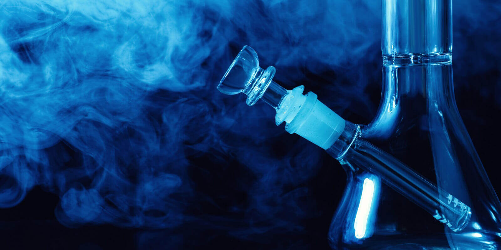 closeup view of glass bong with smoke on black background in Boston, MA
