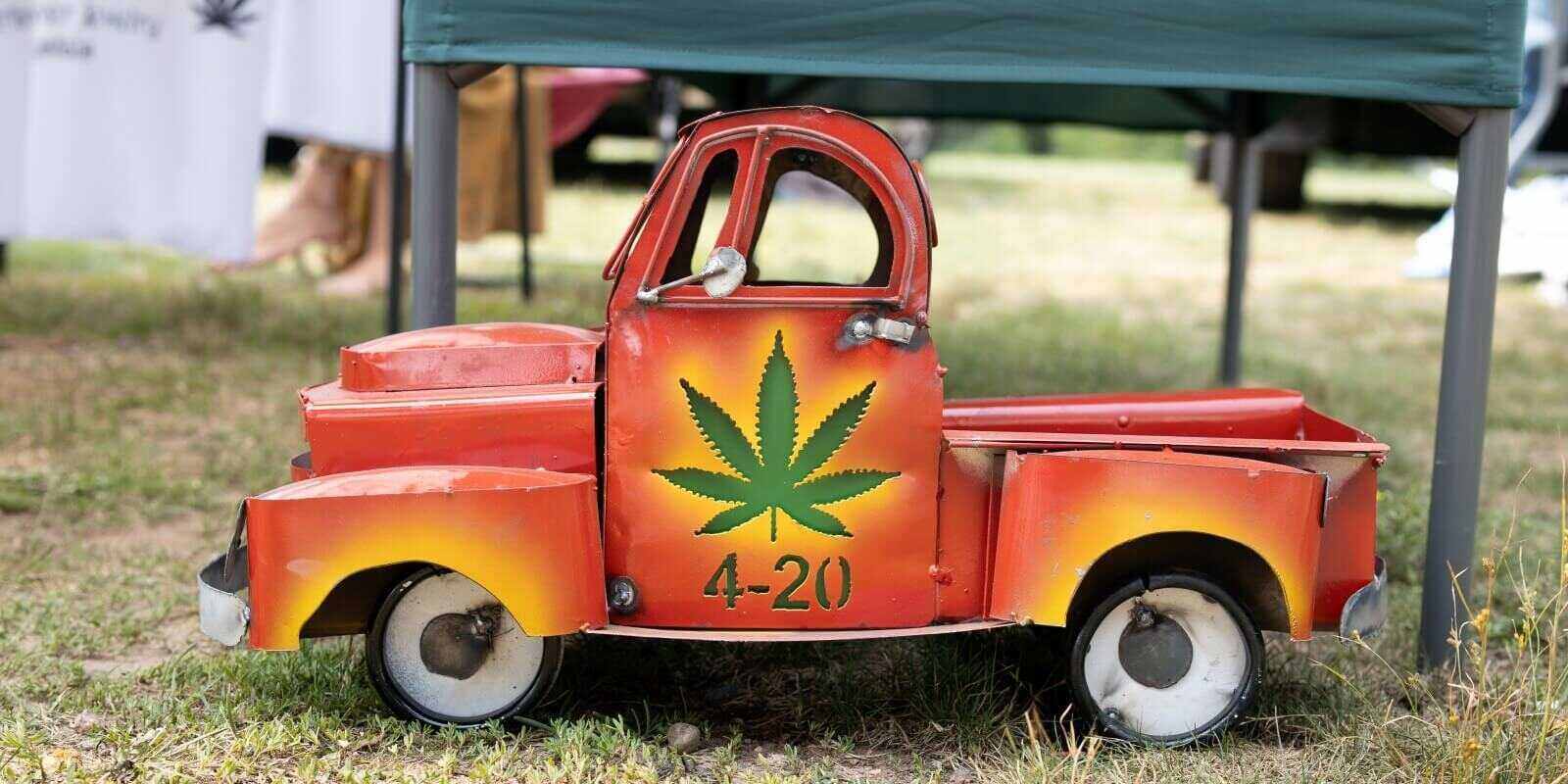 vintage toy truck with 4-20 marijuana flower on door in Boston, MA