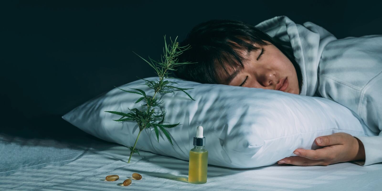 girl sleeping in evening bedroom with cannabis oil from Boston dispensary