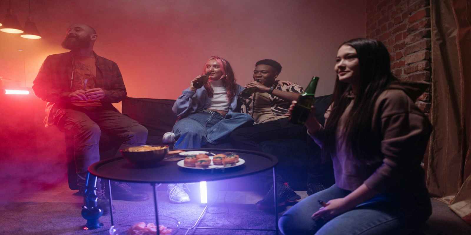 Group of Friends Having Drinks and Edibles at Night bar in Downtown Boston