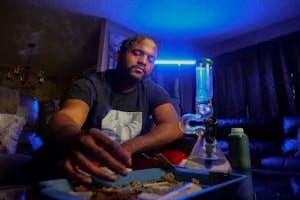 Man Having Edibles in A Dark Room in Boston